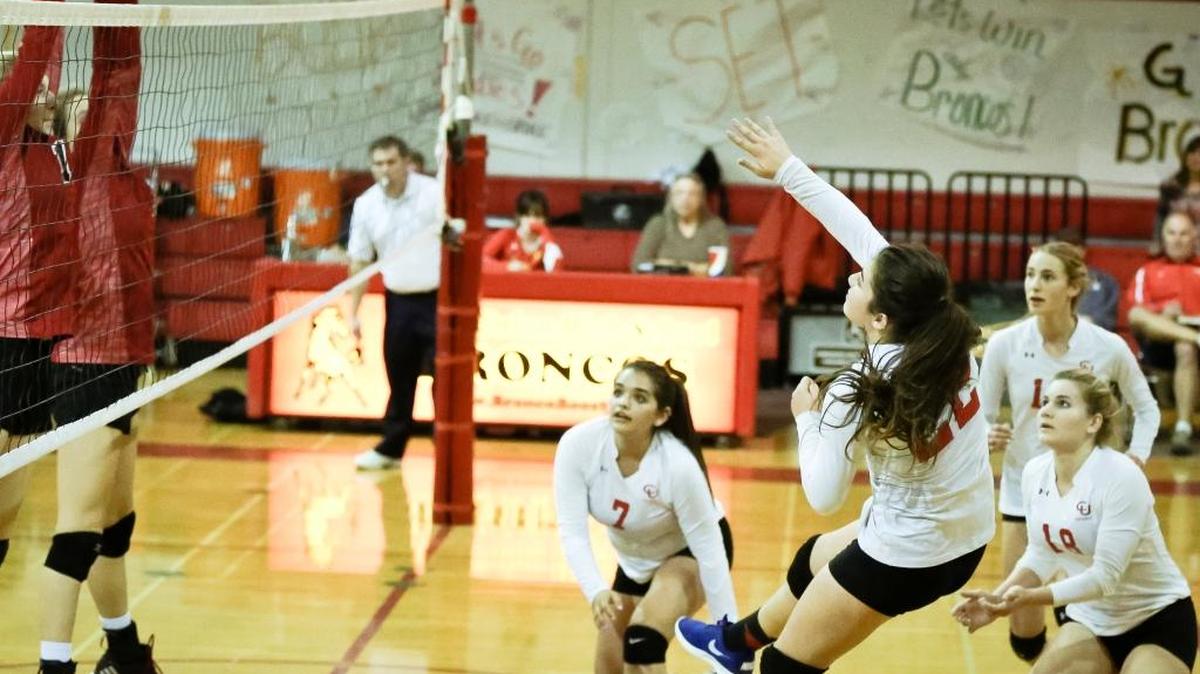 Ailyn Casas (22) serves for Coast Union against Santa Clarita Christian in a CIF playoff match Tuesday, Nov. 2. Casas had eight kills and four aces.