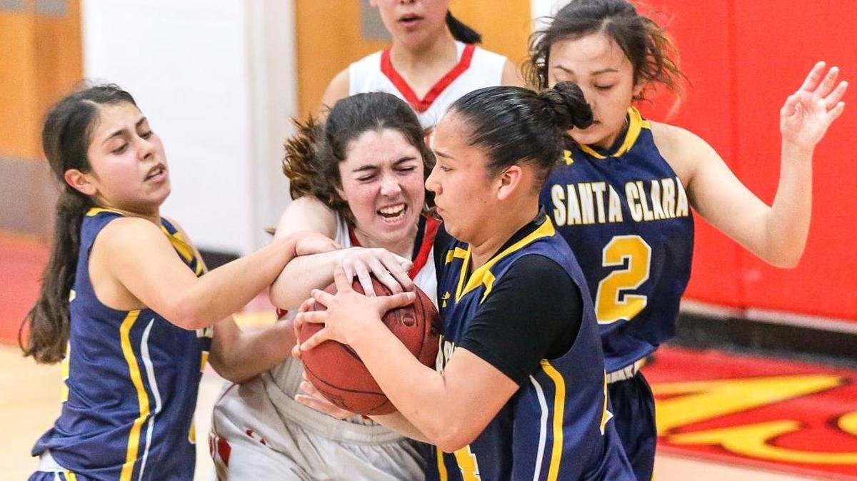 Senior forward Zoe Markham battles for control of the basketball during the Broncos’ 44-37 playoff defeat at the hands of Santa Clara on Saturday night, Feb.17.