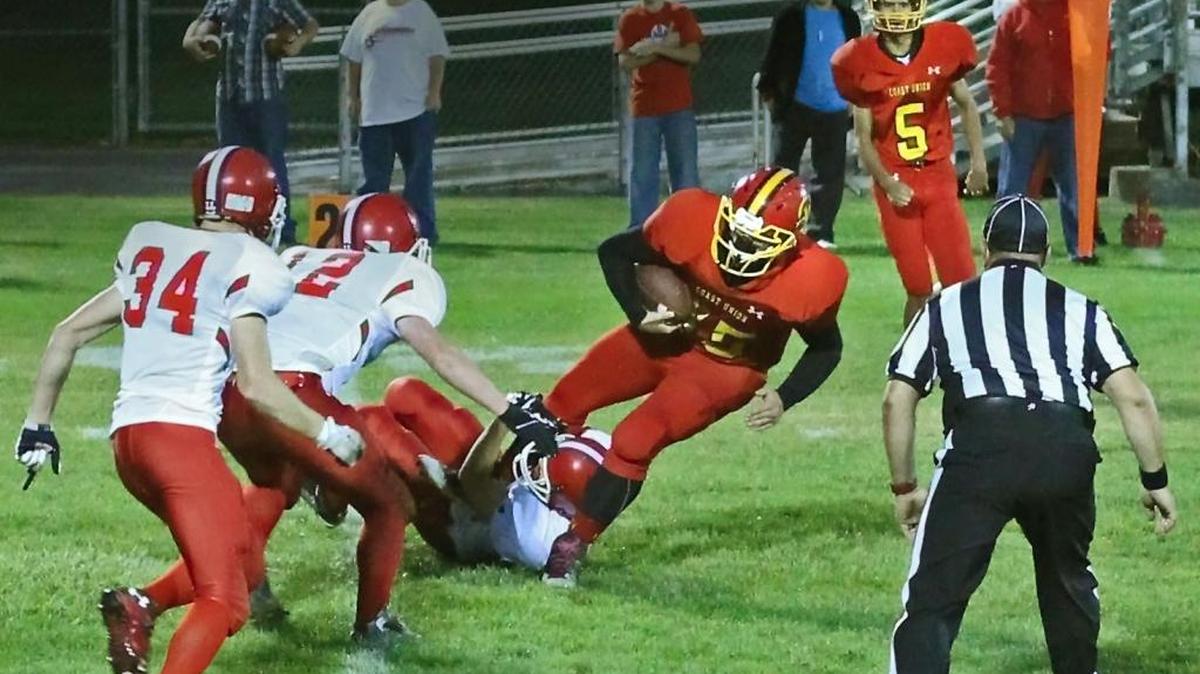 Senior Lane Sutherland won the MVP for his defensive play this fall, but he also scored four touchdowns over the final four football games. Here he picks up yardage against Shandon on Oct. 9.