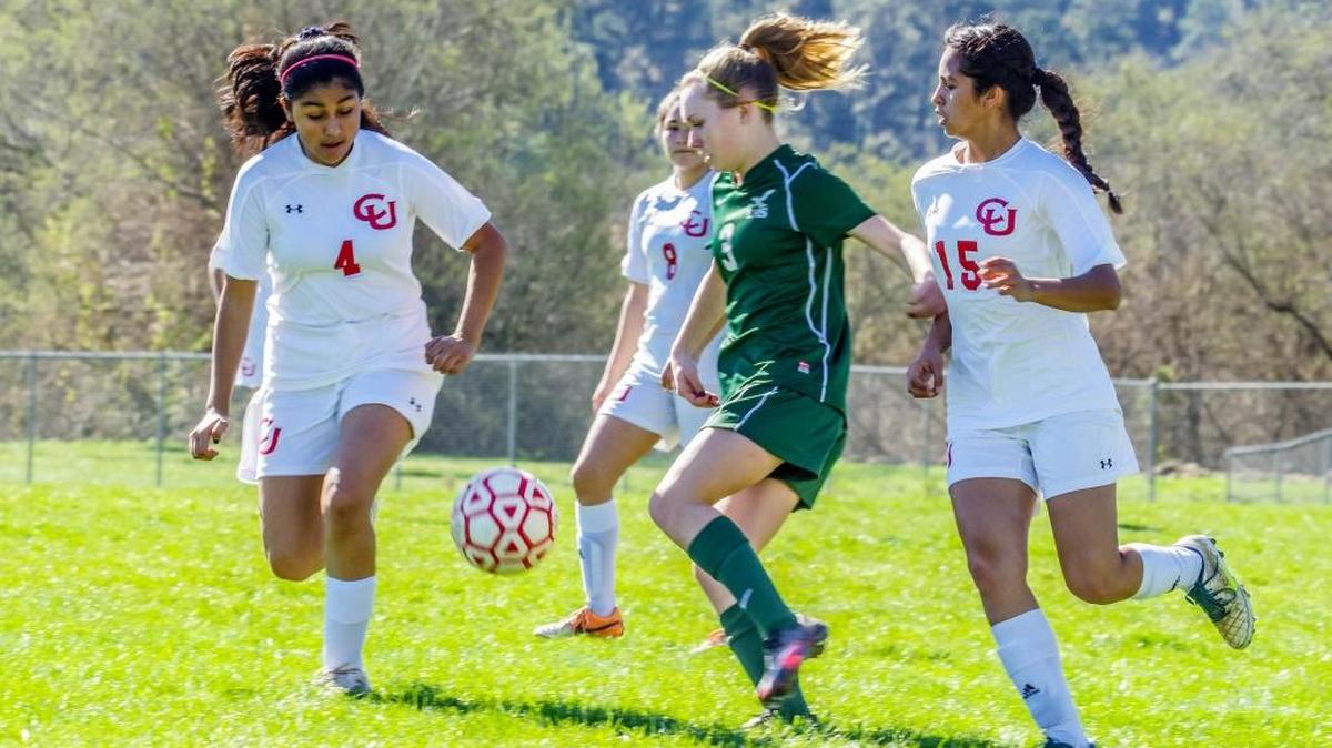 Diana Cisneros (15) will graduate with the seniors on the team, but sophomore Karina Mendoza (4) will return next season for the Lady Broncos soccer team. Here they battle a Midland player for the ball earlier this season.