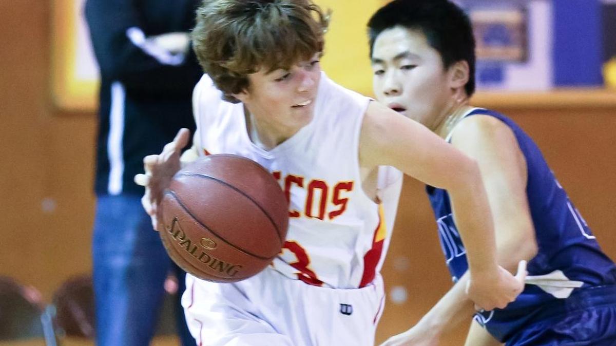 Bronco freshman Nate Markham scored 16 points in the Coast Union Holiday Tournament this past weekend. Here he drives past a defender earlier in the season.