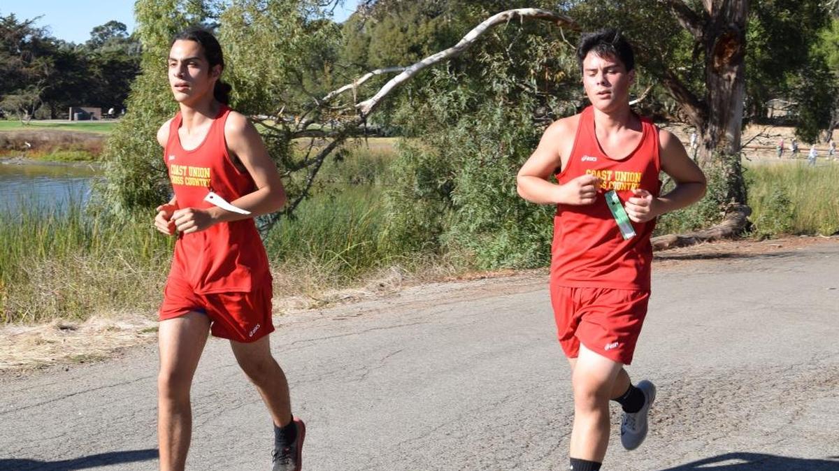 Coast Union runners Alam Romo, left, and David May compete in the SLO County Championships in San Luis Obispo on October 26.