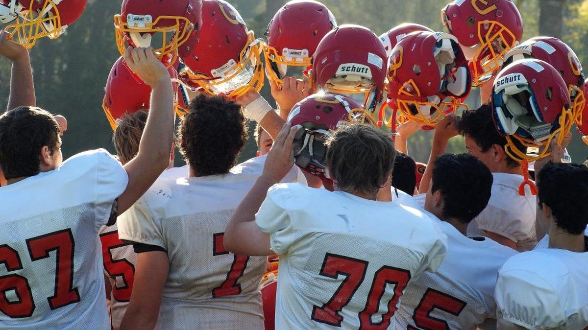 Win or lose, the Bronco football tradition is to come together at the conclusion of a game and hold helmets high. Here the team showed school pride after the game at Laguna Blanca on Sept. 9.