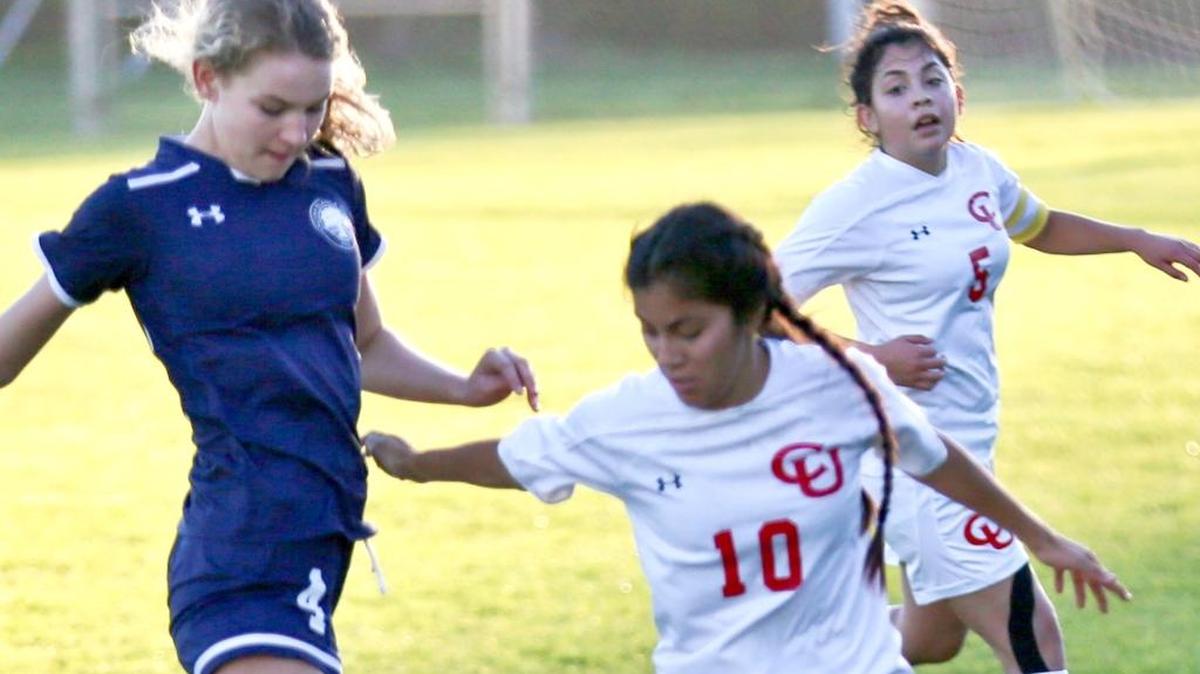 Senior midfielder Fabby Gonzales, right, battles for control of the ball against Laguna Blanca on Dec. 13 at Coast Union. Labuna Blanca won 1-0.
