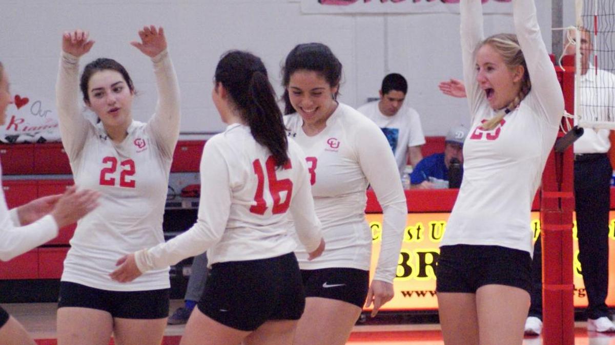 Coast Union players celebrate Tuesday night, Oct. 24, when they wrapped up regular-season play with a victory over Valley Christian Academy. Coast finished a perfect 10-0 in Coast Valley League play.