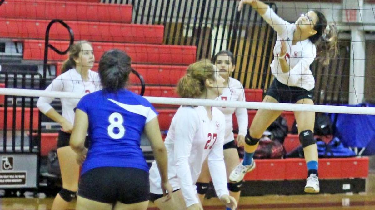 Senior Xue DiMaggio has shown great leadership this season, according to head coach Pam Kenyon. Here DiMaggio shows her vertical jump and return skills against Shandon in October.