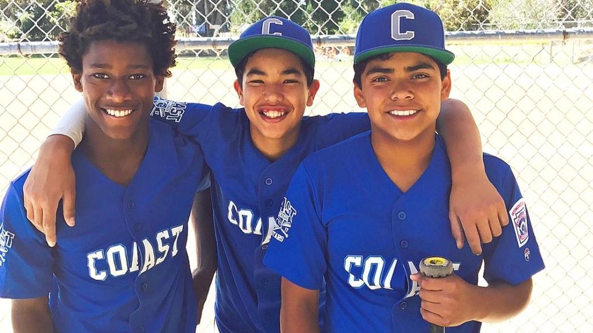 Cambria Reds Little Leaguers Anhase Martin, Michael Sison and Emi Pena enjoy a victory moment after making major contributions to the Coast All-Stars’ doubleheader wins over the Atascadero All-Stars in Los Osos on Saturday, June 10. Martin and Sison will attend Mission Prep in San Luis Obsipo this fall rather than Coast Union.