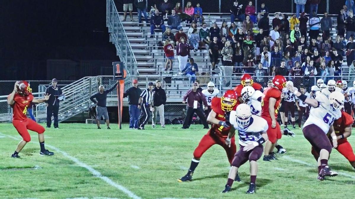 Senior Alexis Mireles began the season at quarterback; he received honorable mention from the Coast Valley League for his play on offense. Here he gets ready to throw a pass from the pocket Sept. 4 against Fresno Christian.