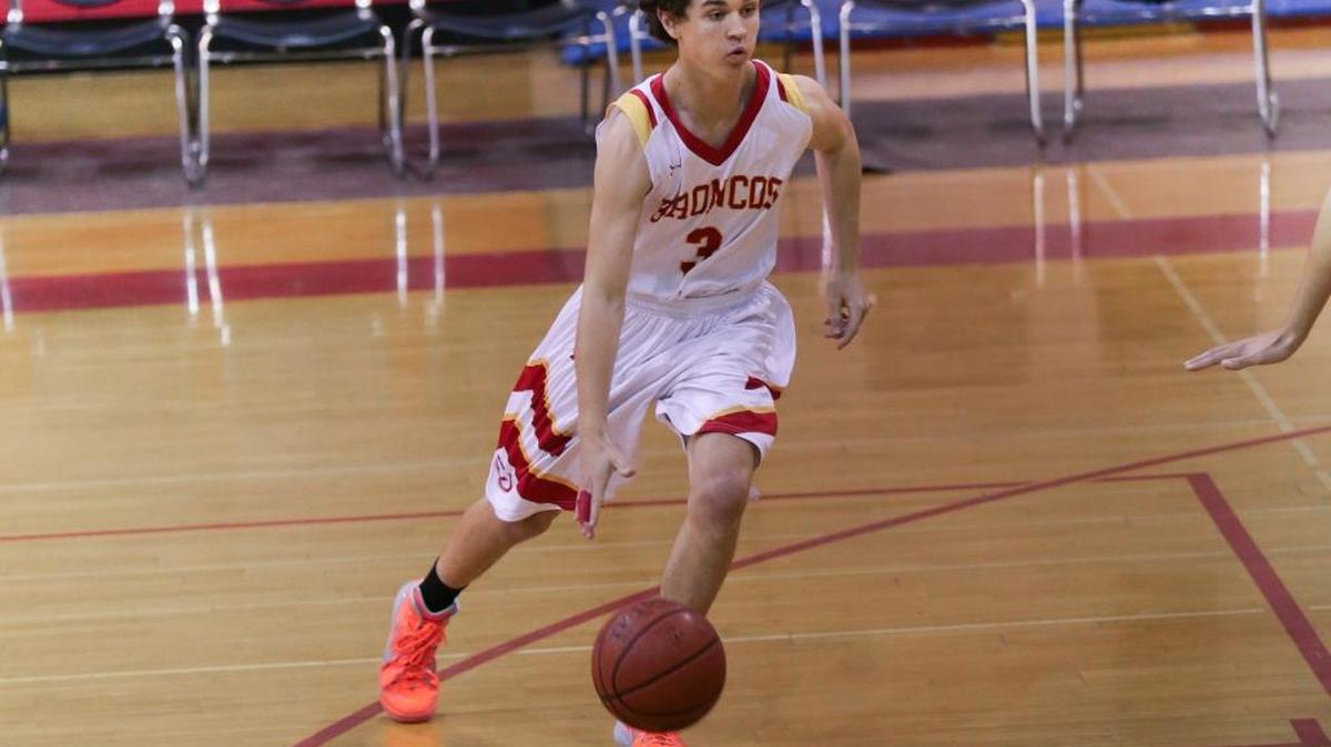 Junior Jack MacKinnon scored 12 points against Shandon on Friday, Jan. 22. Here he drives to the basket against Valley Christian earlier in the season.