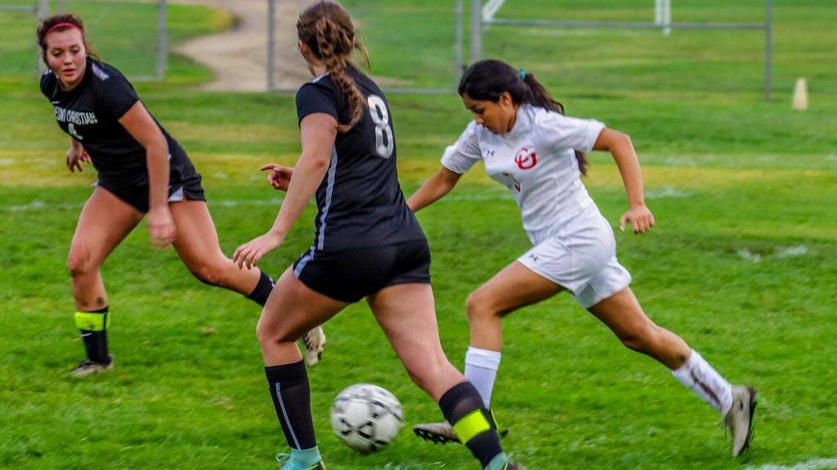 Senior Karina Mendoza received the Coach's Award from first-year Coast Union girls soccer coach Brooklin Brumund.