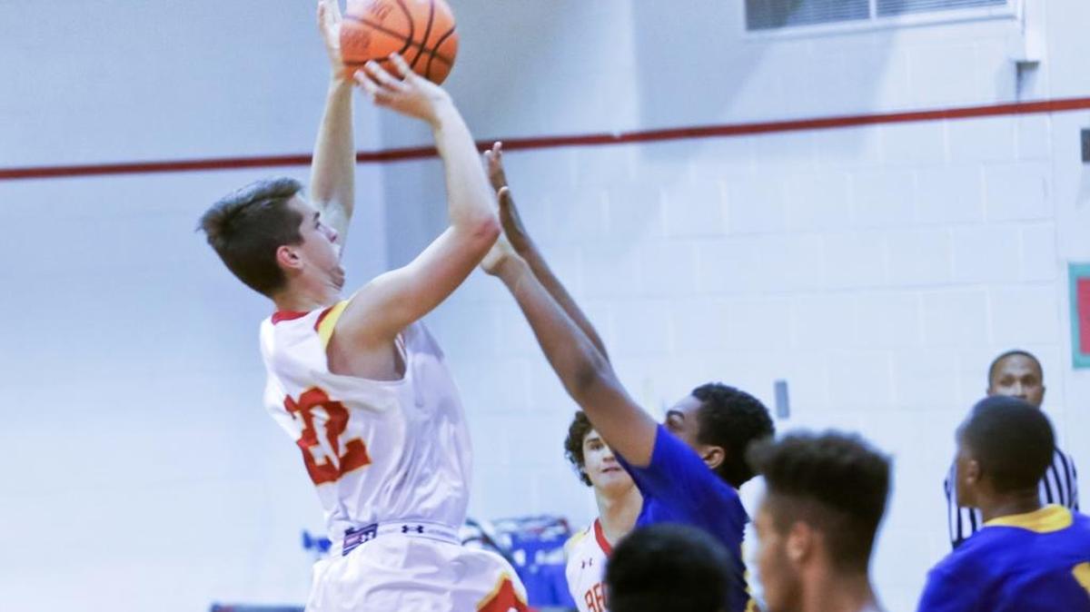 Senior Sam MacKinnon led the Broncos in scoring with 38 points in the four-game Santa Barbara Holiday Classic Tournament. Here he scores in a CIF playoff game last year against AGBU.