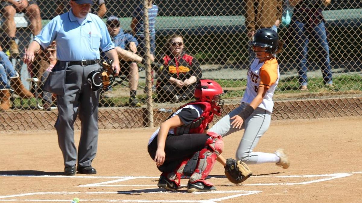 Coast Union catcher Alyssa Drew tags a Santa Ynez runner trying to score early in the Broncos’ 13-0 CIF playoff loss May 18.