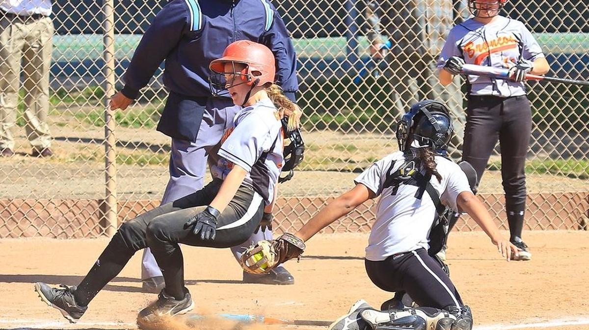 Sophomore infielder Ani Corbet slides in safely to score during Coast Union’s 12-2 win over Orangewood Academy.