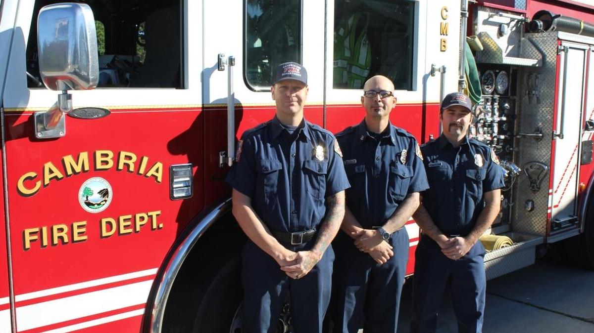 From left, Mike Burkey, Dan McCrain and Michael Castellanos stand in front of the Cambria Fire Station early this month.
