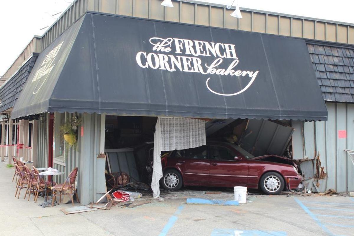 A Mercedes remained wedged into the wall of the French Corner Bakery in Cambria until it was deemed safe to remove it.