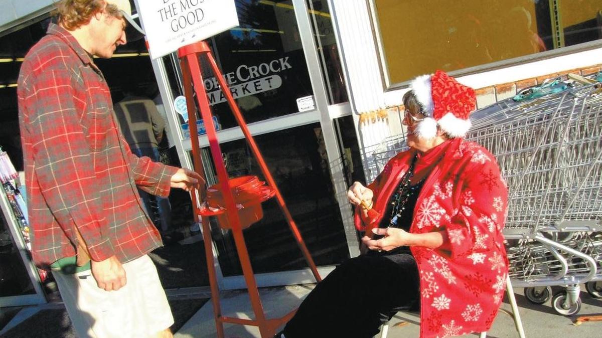 Cambrian reporter Kathe Tanner staffs a Salvation Army kettle in December 2007 at the Cookie Crock supermarket in Cambria.