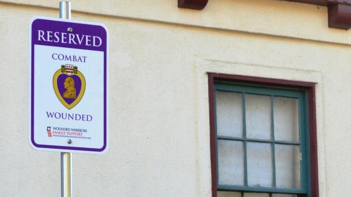 One of the new Purple Heart signs at the Veterans Memorial Building parking lot in Cambria.