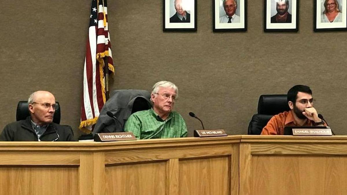Coast Unified trustees, from left, Dennis Rightmer, Lee McFarland and board President Samuel Shalhoub listen during the Jan. 11 board meeting.