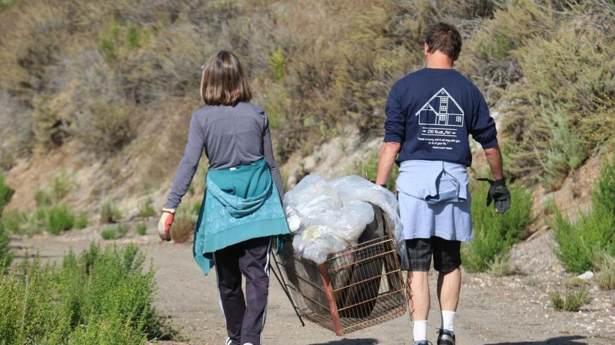 Volunteers carry garbage out of Pirate’s Cove, which produced the most trash of any San Luis Obispo County site on Coastal Cleanup Day.