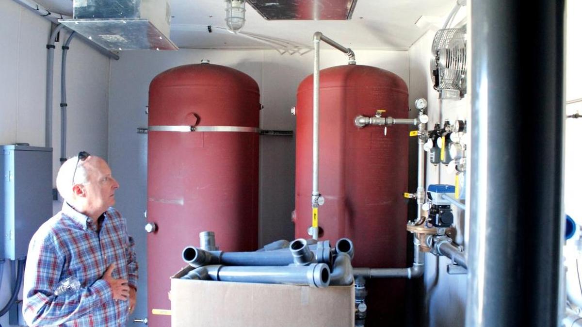 Tom Gray looks at equipment inside the microfilter unit at the Sustainable Water Facility in 2014. Gray has resigned as the CCSD’s public information officer.