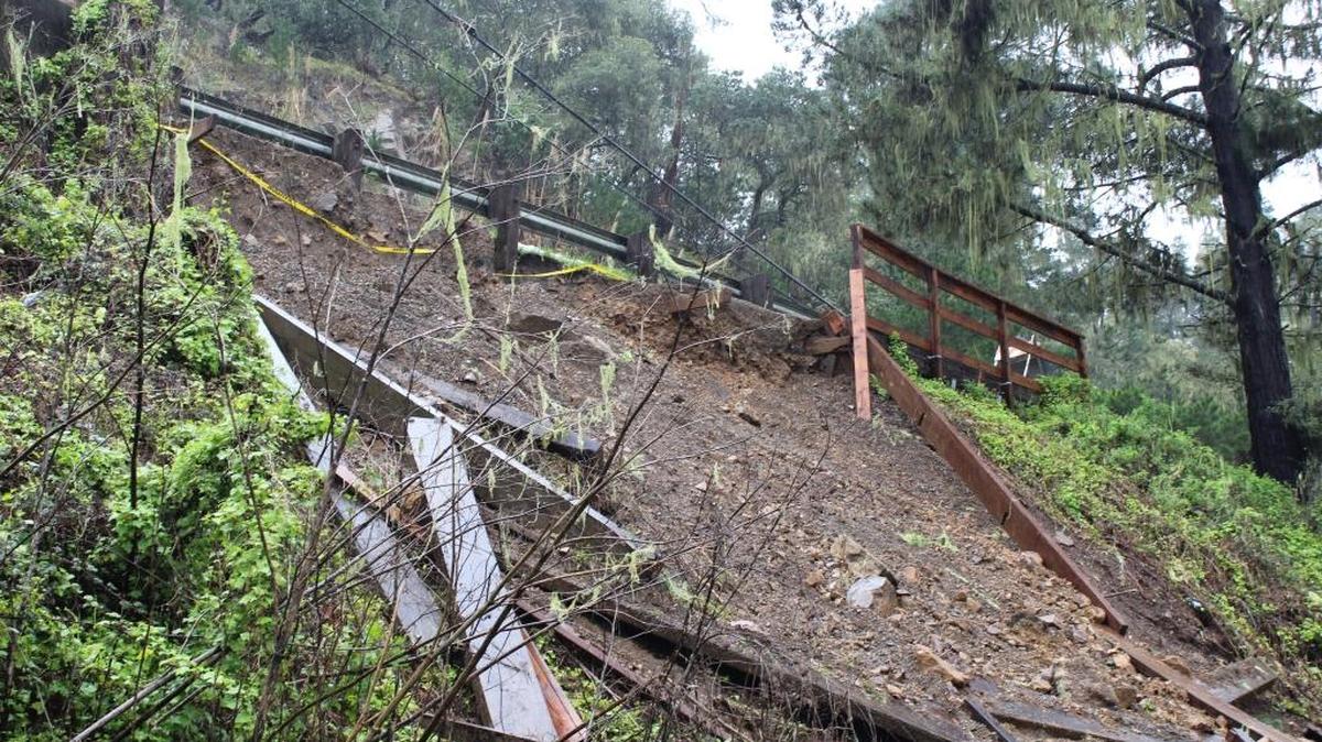 A portion of a hillside shows erosion along Burton Drive as it descends into Cambria’s business district Sunday morning. Sandbags had been placed at the top of the incline, which is at the back parking lot of Cambria Hardware in the community’s “Tin City” industrial complex.