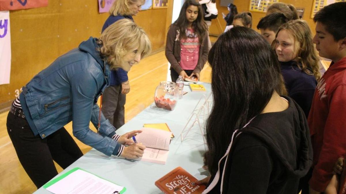 Wendelin Van Draanen signs books for Santa Lucia Middle School students following Monday’s assembly in the gym.