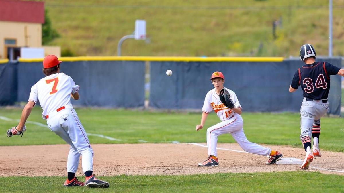 Pitcher Chase Volz (7) fires the ball to Will Stephenson at first base in time to get the out on Friday, May 6, 2016, at Coast Union.