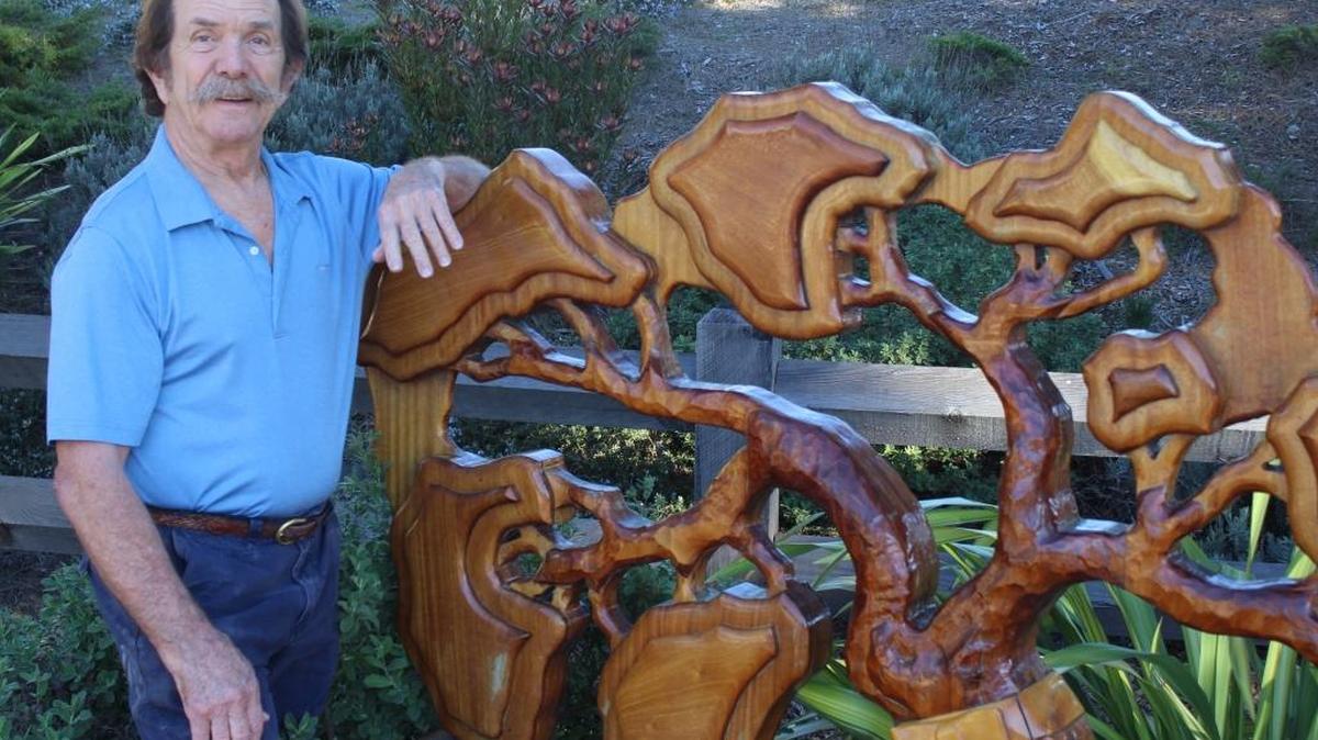 Jay Burbank, Cambria’s 2016 Citizen of the Year, carved this wooden bench near the Veterans’ Memorial Building flag stand to honor a friend killed in a workplace shooting.