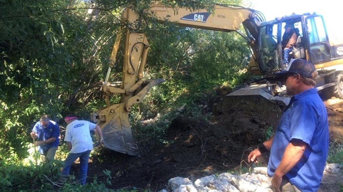Jason Buhl, the CCSD’s water systems supervisor, right, supervises preliminary work at the leak site earlier this week.