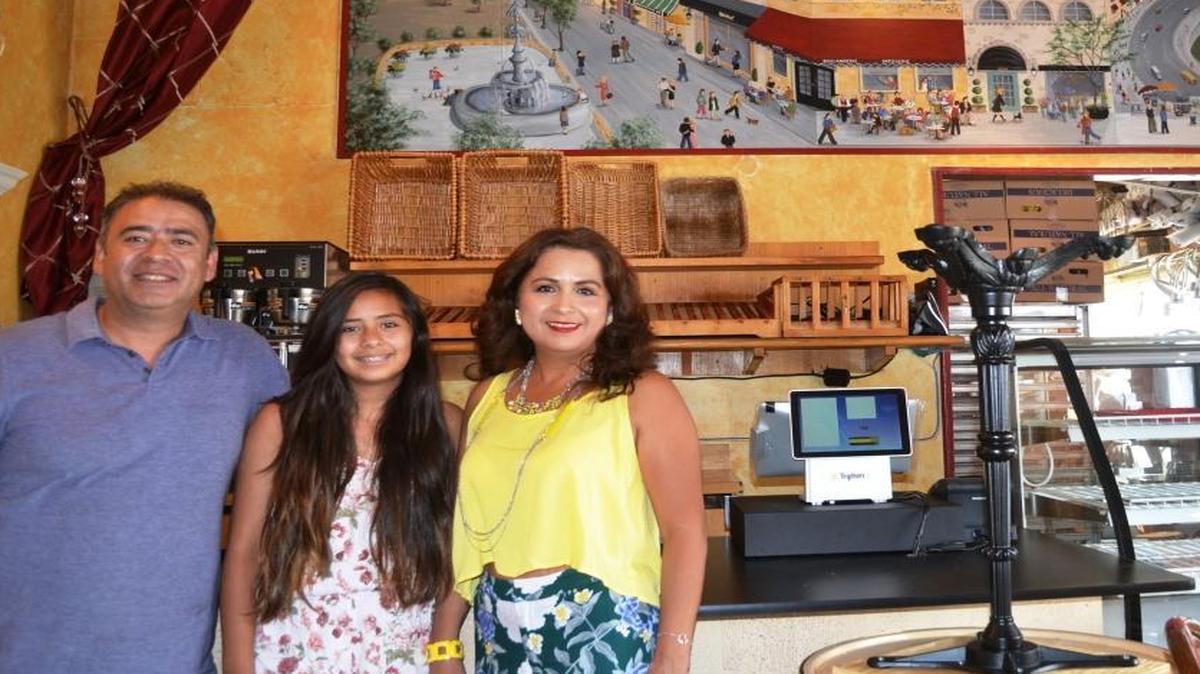 Miguel, 13-year-old Sandra and Lupe Viveros stand in the main room of The French Corner Bakery in Cambria’s East Village, which will open for the first time in four months since being hit in a vehicle crash.