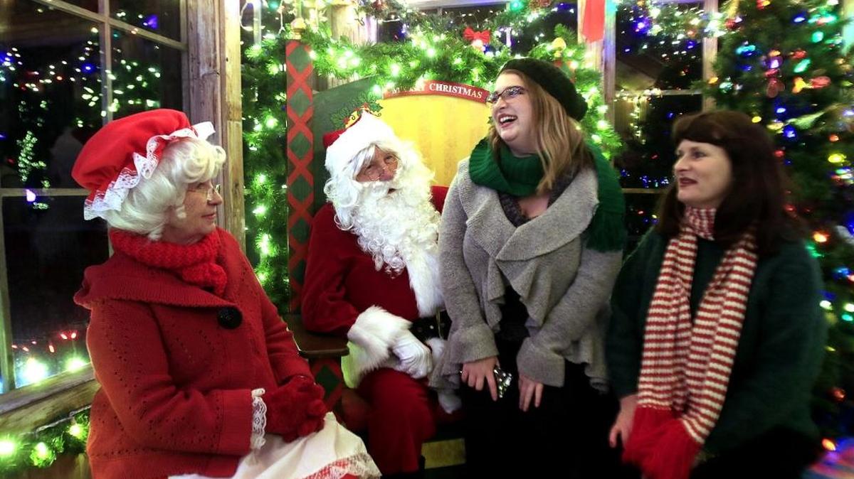 Marcia Thormey and her daughter Ariel Bruce visit Santa’s photo booth at the Cambria Christmas Market.