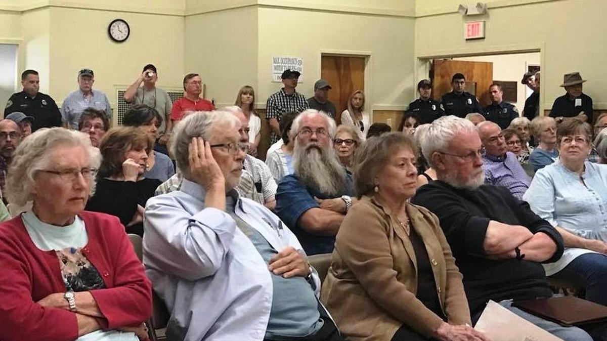 An overflow crowd watches the Cambria Community Services District board consider a potential ballot measure to fund three firefighter positions.