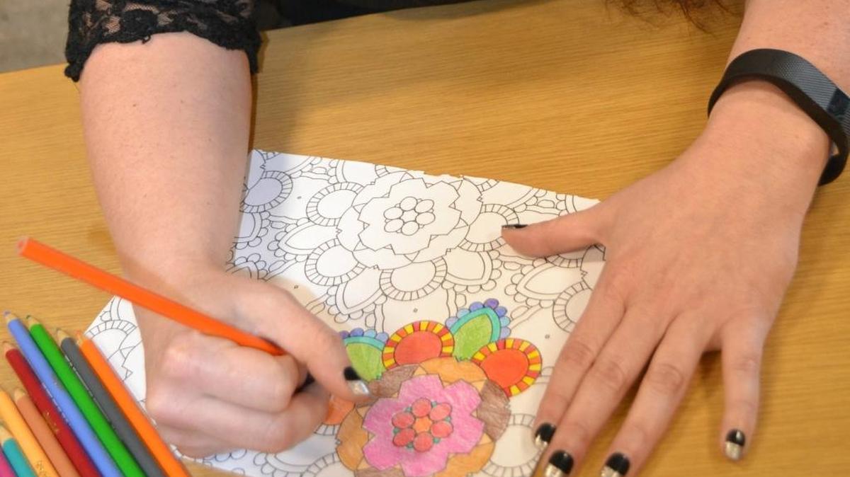 Destiny Carter, senior library associate at the Cambria Library, plans an extra session of the Adult Coloring Club this month.