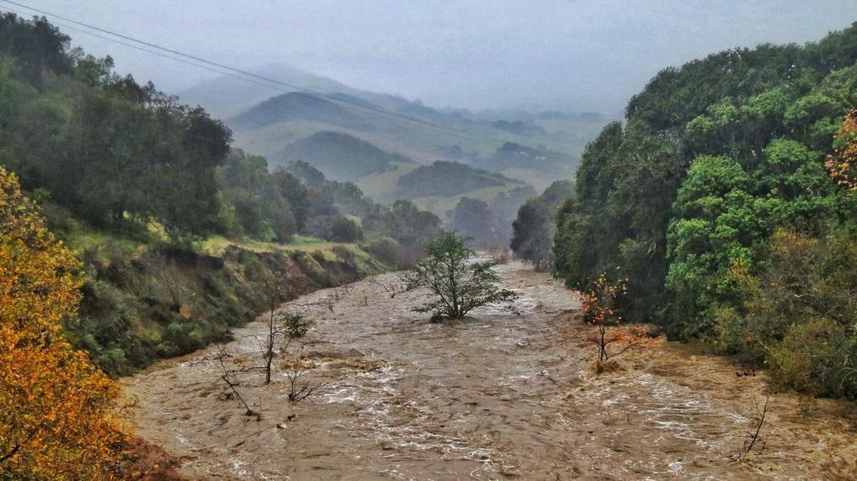 Floodwaters race down Santa Rosa Creek.