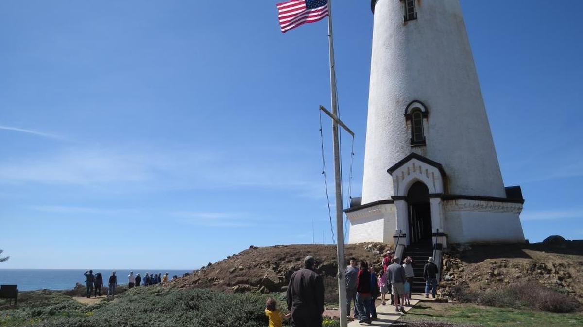 Visitors enter the Piedras Blancas Light Station on an earlier tour.