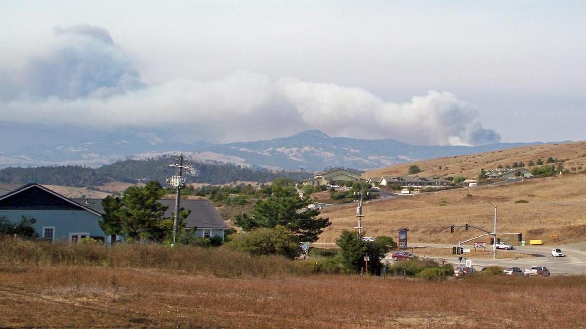 Smoke from the Chimney Fire can be seen from a hillside above Highway 1 and Ardath in Cambria on Aug. 19.