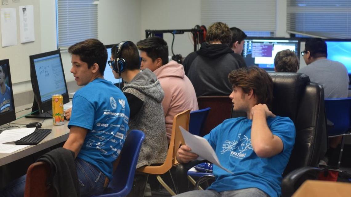 Luis Plascencia, left, and Jack Azevedo, in the blue shirts, are part of Coast Union’s “Cyber Patriot” team, which will compete in the state finals Jan. 19-21 after qualifying Dec. 8. Also pictured, from left: Crecencio Atunez, Axel Beccerril, Jonathan Jewel, Trent Ferguson, Daniel Dubnow and Antonio Atunez.