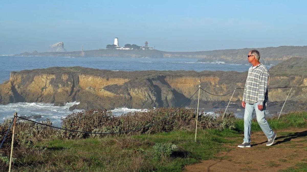 Phil Adams walks the trail near Piedras Blancas named for the late Jim Boucher.