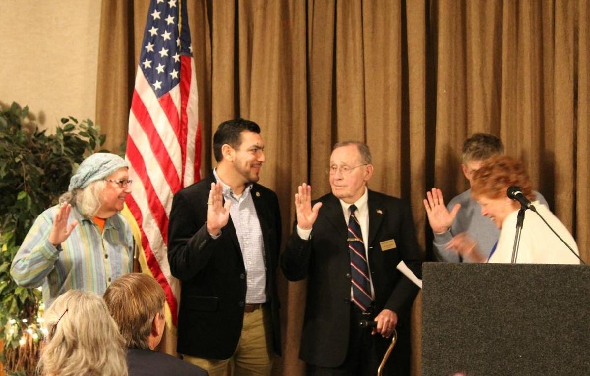 Cambria Chamber Vice President Sue Robinson, right, swears in newly elected board member Oz Barron, left, and re-elected members, from left, Miguel Sandoval, President Mel McColloch and Steve Kniffen.