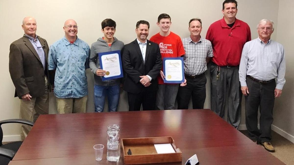 Assemblyman Jordan Cunningham, center, presented certificates to Luis Plascencia and Trent Ferguson, flanking him, Aug. 14. Plascencia, a sophomore, and Ferguson, a freshman, were two members of the Coast Union cyber team that was named Best New Team at the California Cyber Innovation Challenge in June. Pictured from left: Trustee Dennis Rightmer, Henry Danielson, Plascencia, Cunningham, Ferguson, Ayen Johnson, Principal Scott Ferguson and Trustee Lee McFarland.