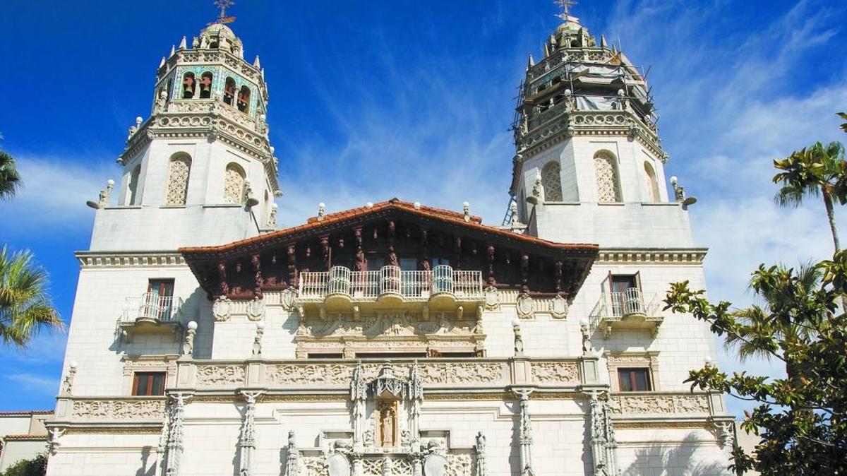 A tour group gathers in the shade in the plaza in front of Casa Grande at Hearst Castle in 2014.