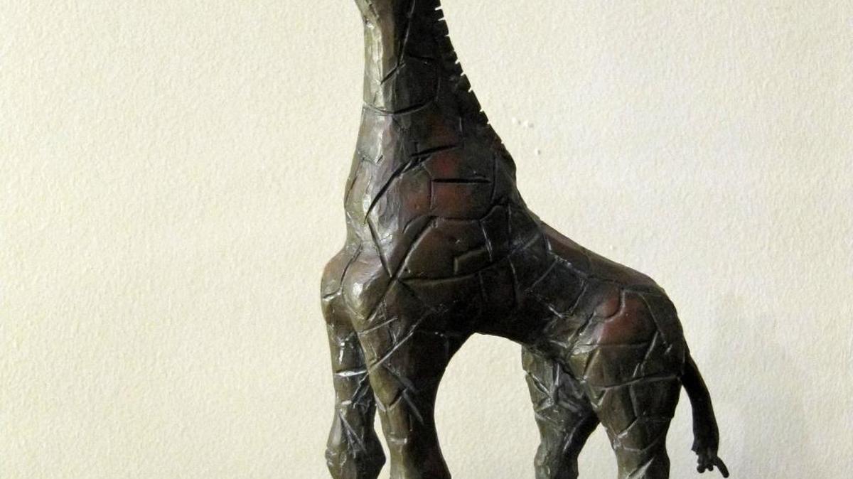 The columnist’s mother created this giraffe sculpture, which survived a fire at the Tanner home in 1994.
