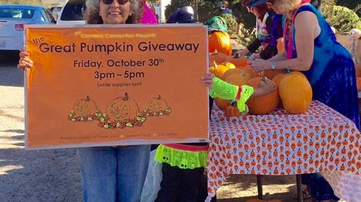 The Cambria Connection gave away pumpkins instead of candy during this year’s Halloween parade. The fruit seems to be everywhere this time of year. Here, Theresa Desmond holds the sign, while Priscilla Desmond (in hat) and Cynthia Pallin stand by.