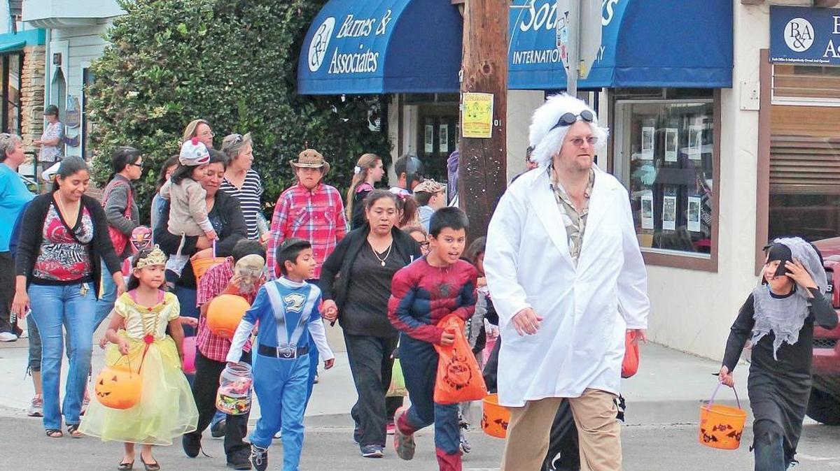 Rick Bruce dressed up as as Emmett “Doc” Brown, the character played by Christopher Lloyd in the “Back to the Future” movie trilogy, to lead local kids in a West Village Halloween Parade in 2014. But the Village Wizard has got some scarier Halloween memories to share.