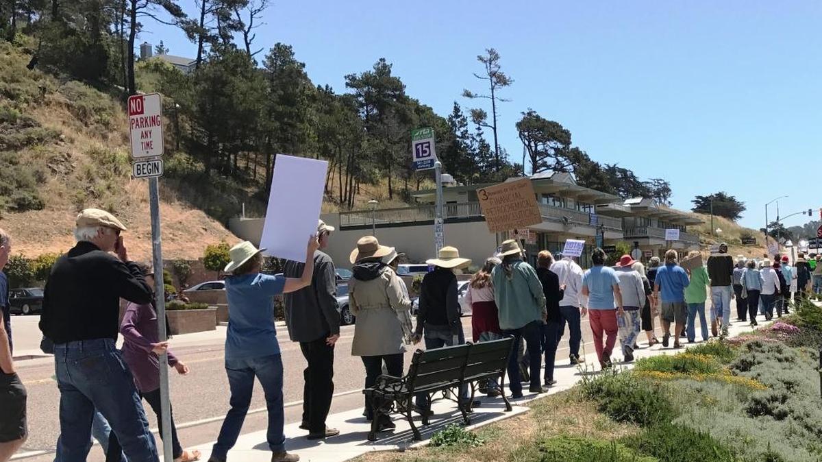 Protesters walk up Cambria’s Main Street from the Veterans Memorial Building during the “March for Truth” on Saturday, June 3.