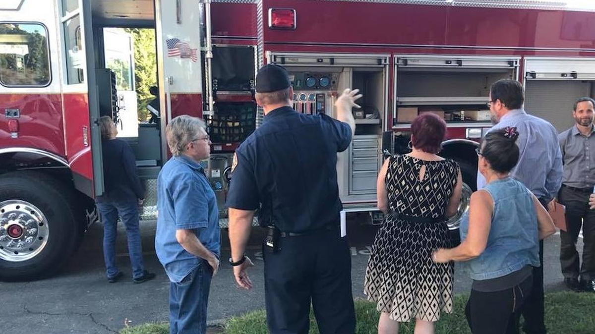 Board President Amanda Rice, center, and Director Aaron Wharton, second from right, are among those getting a look at the Cambria Fire Department’s new engine during a break in the Oct. 26 Cambria Community Services District board meeting.