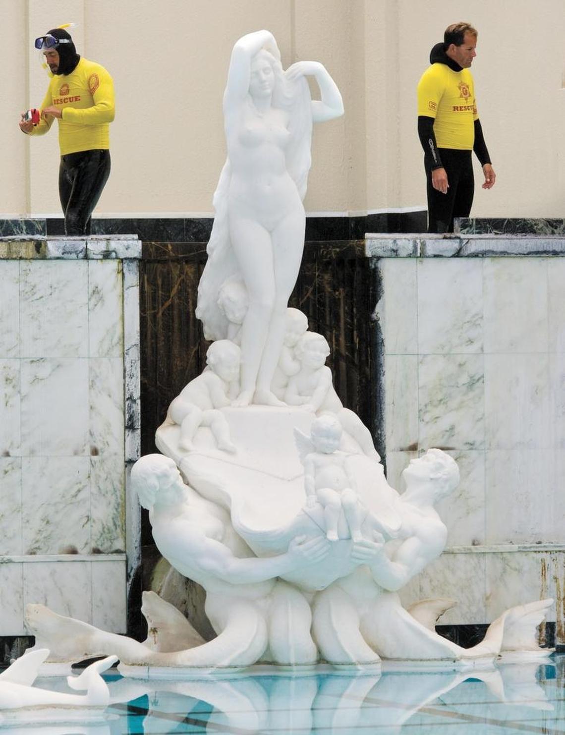 State Parks dive team members Eddie Rhee-Pizano, left and Chip Bockman were two of the four divers that surveyed the Neptune Pool at Hearst Castle for leaks in late 2013. Divers were mapping cracks and tracing leaks. The statue depicting the Birth of Venus is in the foreground.