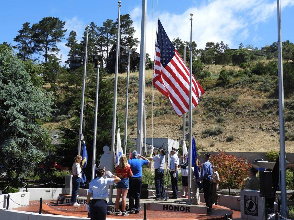 Military representatives and local students salute the raising of the American flag during a Memorial Day ceremony at the Cambria Veterans Memorial on Monday, May 27, 2019. Local Memorial Day ceremonies look different in 2020 due to the coronavirus pandemic.