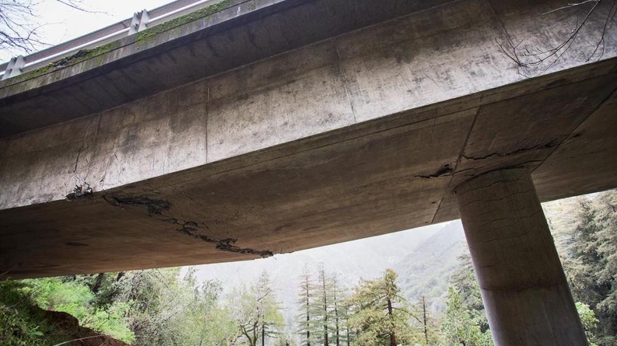Cracks and buckling concrete demonstrate why Pfeiffer Canyon Bridge south of Big Sur has been closed to all vehicle and pedestrian traffic.
