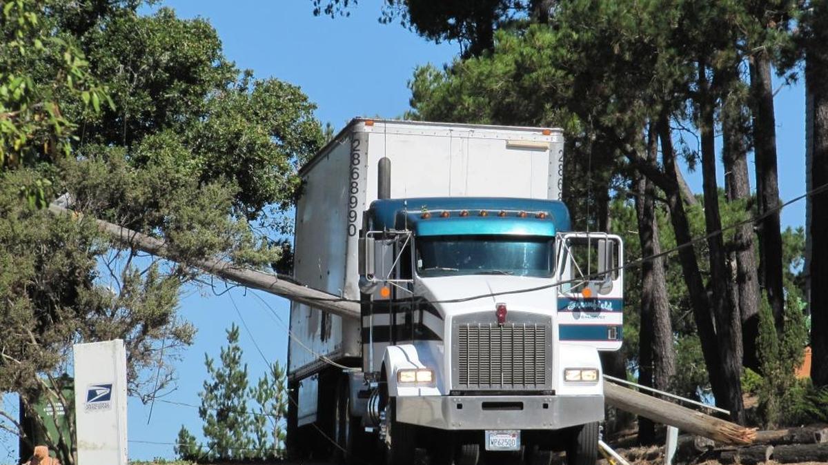 A power pole fell on a truck on Lodge Hill, cutting power to about 50 customers.